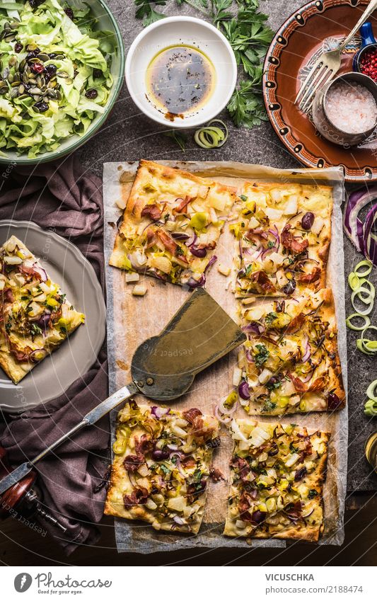 Tarte flambée and salad Food Vegetable Lettuce Salad Dough Baked goods Bread Herbs and spices Nutrition Lunch Organic produce Crockery Plate Bowl Fork Spoon
