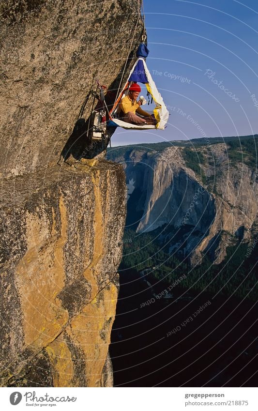 Rock climber in his shelter. Adventure Sports Climbing Mountaineering Rope 1 Human being Helmet Athletic Tall Bravery Self-confident Success Power