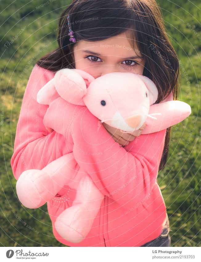 Girl holding stuffy Happy Playing Sun Easter Human being Woman Adults Hand Grass Toys Doll Teddy bear Embrace Cute Clean Green Pink Emotions Safety