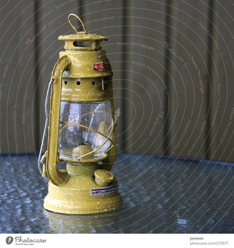do NOT fill ABOVE the line Lamp Wet Yellow Lantern Light Dark Illuminate Glass kerosene lamp Colour photo Exterior shot Deserted Copy Space right Oil lamp
