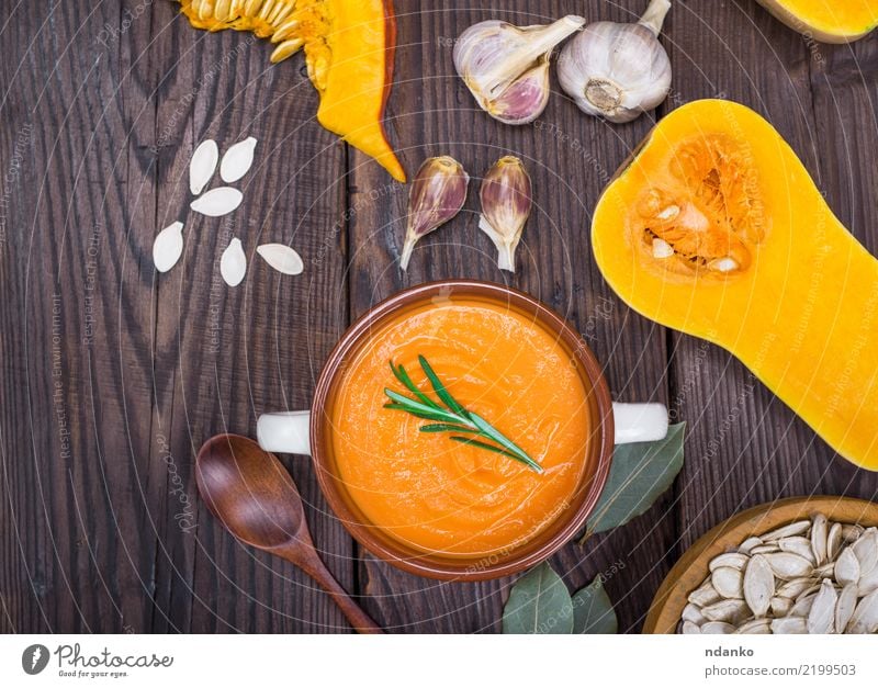 pumpkin soup in a ceramic plate Vegetable Soup Stew Eating Lunch Dinner Organic produce Vegetarian diet Bowl Spoon Table Hallowe'en Autumn Wood Fresh Above