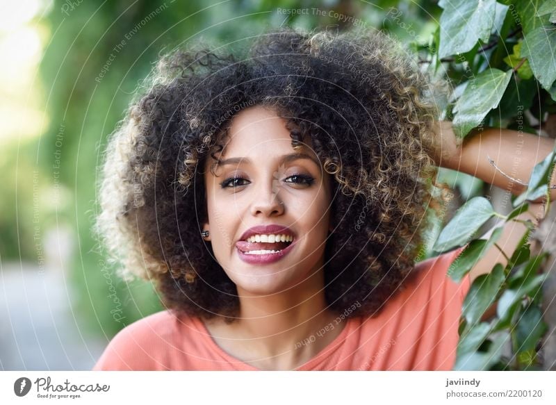 Black woman with tongue out in an urban park Lifestyle Style Joy Happy Beautiful Hair and hairstyles Face Human being Woman Adults Fashion Afro Smiling