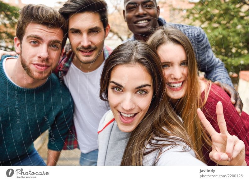 Group of multi-ethnic young people having fun together outdoors Lifestyle Joy Happy Human being Woman Adults Man Friendship 5 18 - 30 years Youth (Young adults)