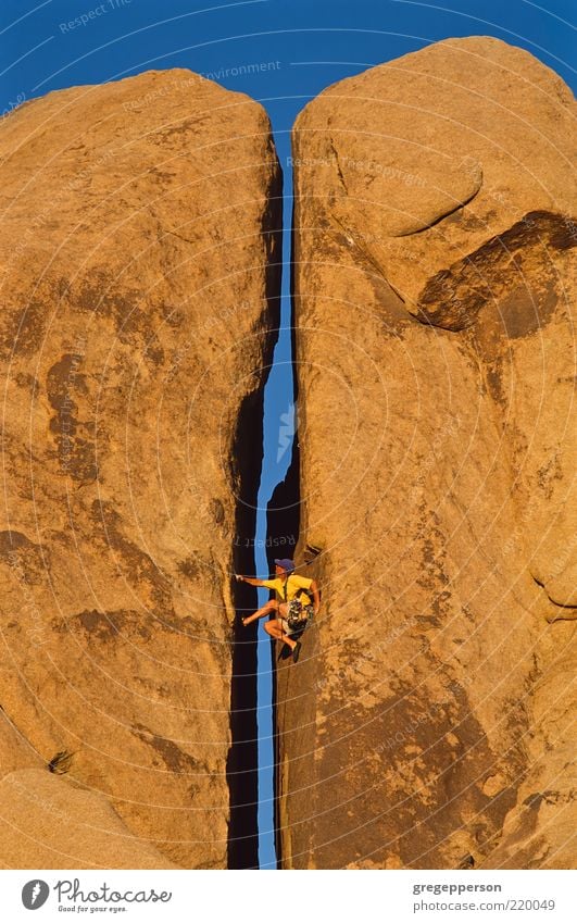 Climber clinging to a cliff. Adventure Sports Climbing Mountaineering Rope Man Adults 1 Human being Athletic Tall Self-confident Determination Loneliness Effort