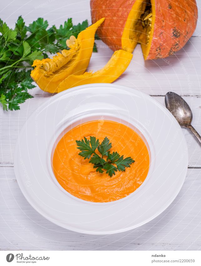 cream pumpkin soup Vegetable Soup Stew Herbs and spices Eating Lunch Dinner Organic produce Vegetarian diet Diet Plate Spoon Decoration Table Nature Autumn Wood