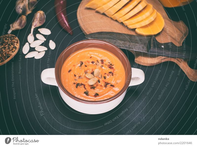 fresh pumpkin soup Vegetable Soup Stew Herbs and spices Eating Lunch Dinner Organic produce Vegetarian diet Bowl Spoon Health care Table Hallowe'en Autumn Wood