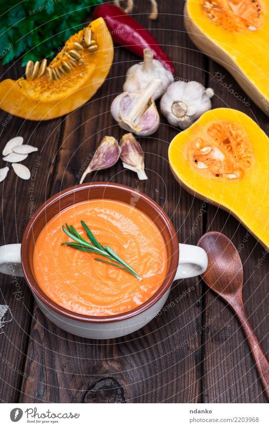 thick pumpkin soup Vegetable Soup Stew Herbs and spices Nutrition Eating Lunch Dinner Vegetarian diet Diet Bowl Spoon Decoration Table Kitchen Hallowe'en Nature
