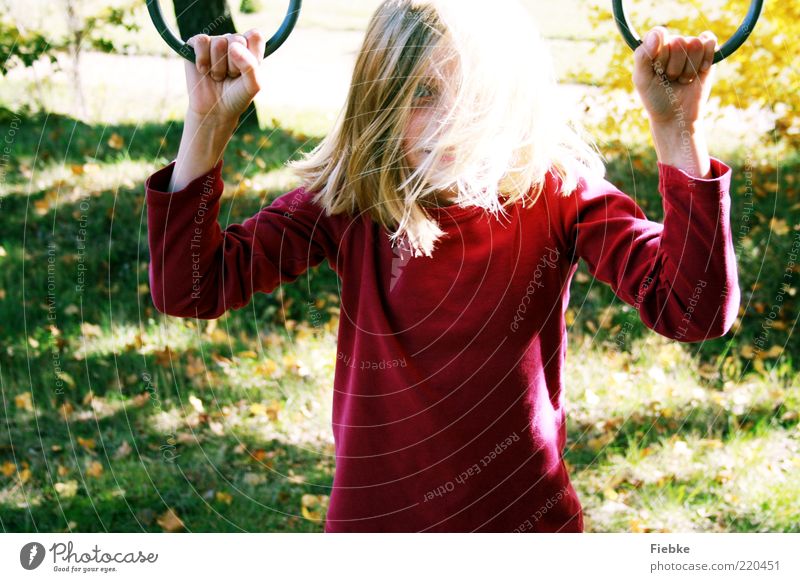 autumn child Playing Child Girl Infancy 1 Human being 8 - 13 years Nature Autumn Beautiful weather Grass Meadow Sweater Blonde Long-haired To enjoy Illuminate