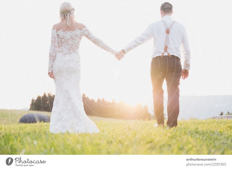Newly married couple walking towards sunset in nature pretty Feasts & Celebrations Wedding Human being Masculine Feminine Young woman Youth (Young adults)