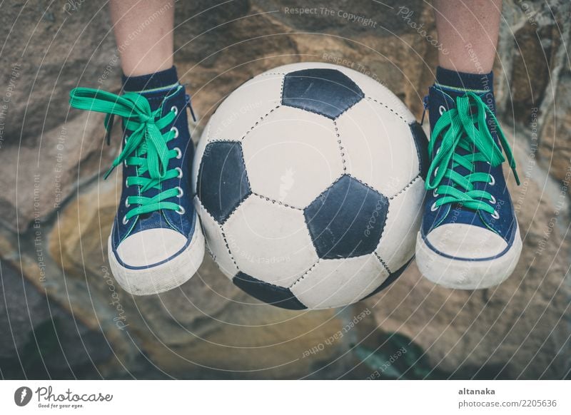 Young little boy sitting with soccer ball. Lifestyle Joy Happy Relaxation Leisure and hobbies Playing Summer Sports Soccer Child School Human being Boy (child)