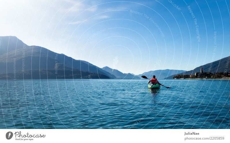 Paddling on Lake Como Como province db Italy Water Calm Watercraft Canoe Driving boating Human being on one's own Mountain Blue Vacation & Travel voyage