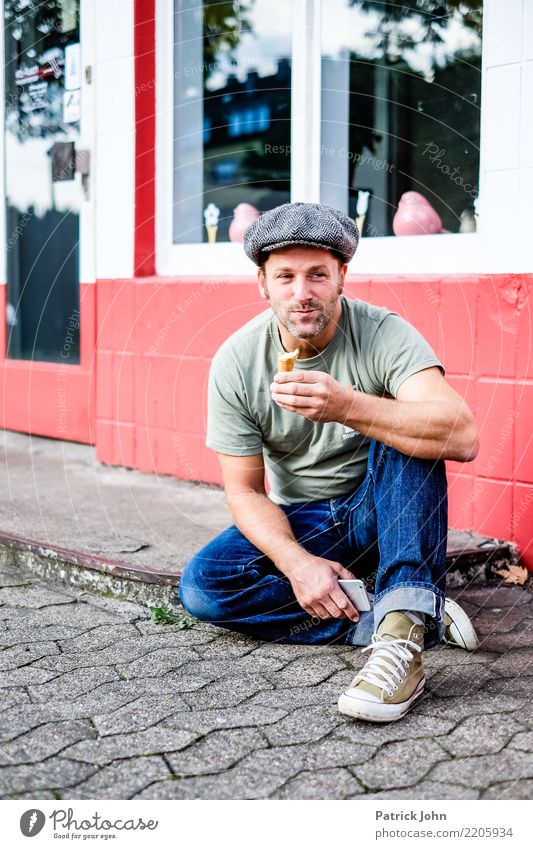 Man eats an ice cream eat ice cream vintage style enjoyment To enjoy Summer Ice Delicious Exterior shot Lifestyle people relaxed middle-aged man jeans Cheerful