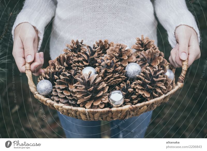 Fir cones in the hands of teenager. Lifestyle Design Winter Decoration Feasts & Celebrations Christmas & Advent New Year's Eve Human being Woman Adults Hand