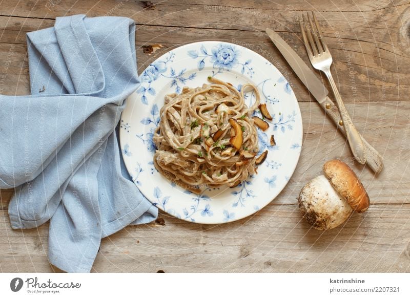 Whole wheat tagliolini with mushrooms Porcini Vegetable Lunch Dinner Vegetarian diet Plate Fresh Delicious Above Yellow White Boletus champignon cream Cooking