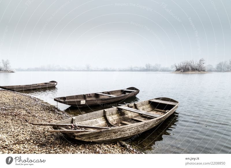 hibernation Nature Landscape Water Sky Winter Lakeside Rowboat Motor barge Watercraft Old Cold Loneliness Grief Sadness Colour photo Subdued colour