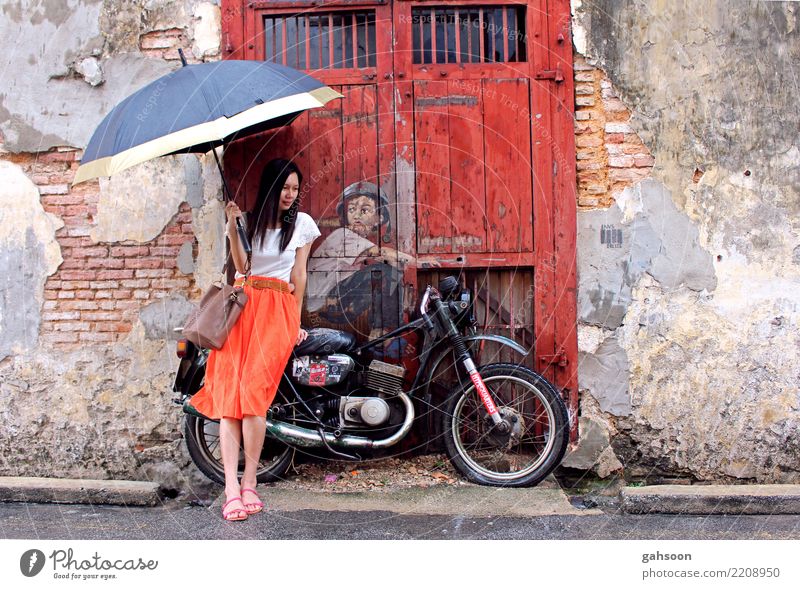 Girl, bike, umbrella Human being Woman Adults Body 1 Rain Malaya Asia Small Town Old town House (Residential Structure) Ruin Wall (barrier) Wall (building)
