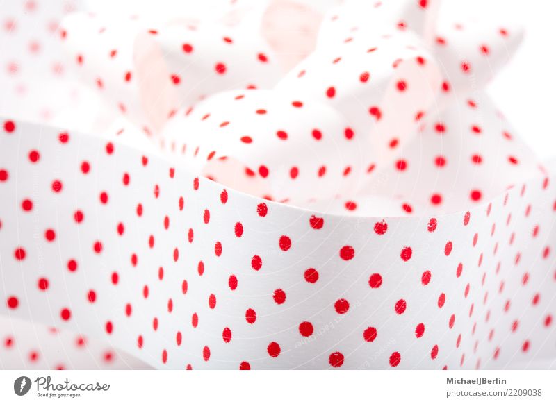 Gift ribbon with red dots on white Feasts & Celebrations Christmas & Advent Red White polka dots Point String Paper Bow Grasp Box up Close-up Section of image