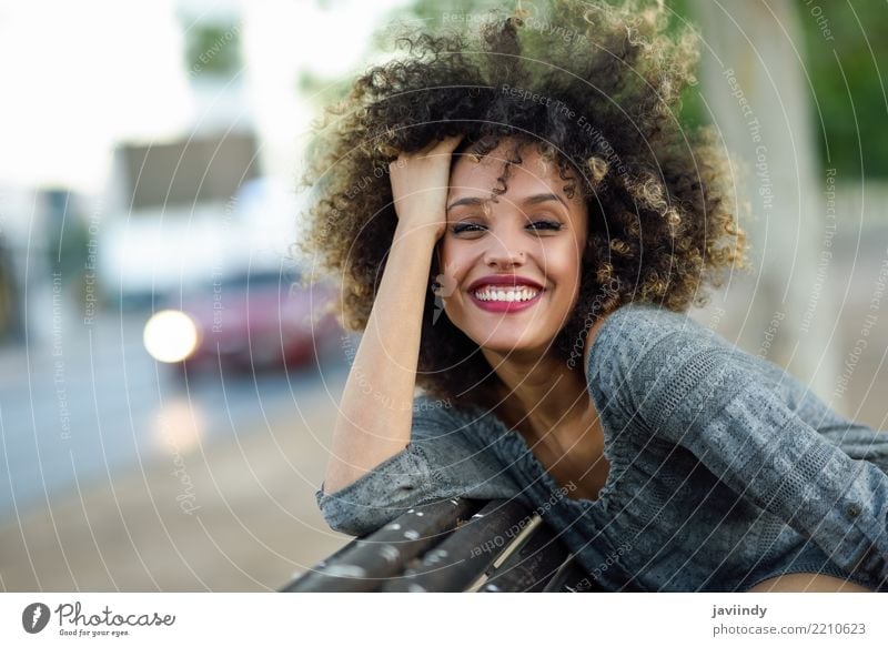 Young mixed woman with afro hairstyle smiling Lifestyle Style Happy Beautiful Hair and hairstyles Face Human being Woman Adults Street Fashion Afro Smiling Cute