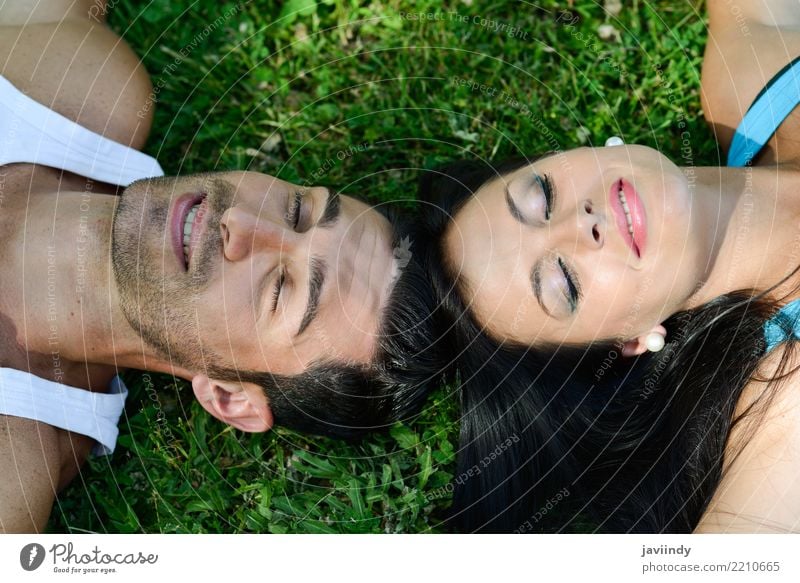 Happy smiling couple laying on green grass Lifestyle Joy Beautiful Relaxation Leisure and hobbies Summer Valentine's Day Human being Woman Adults Man