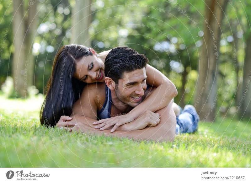 Happy smiling couple laying on green grass Lifestyle Joy Beautiful Relaxation Leisure and hobbies Summer Valentine's Day Woman Adults Man Family & Relations