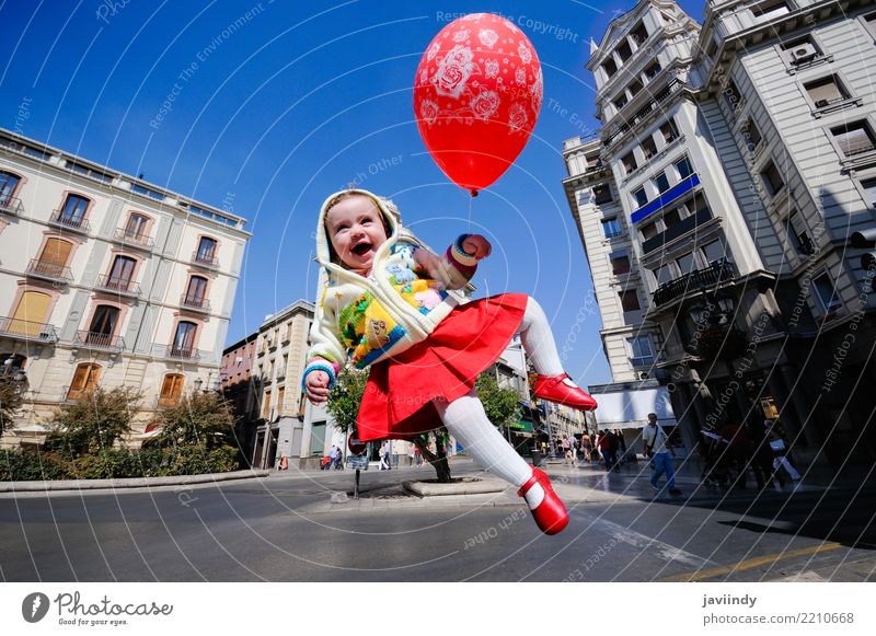 Small baby girl flying with a red balloon in the city Feminine Baby 1 Human being 1 - 3 years Toddler Happiness Fresh Emotions Joy Joie de vivre (Vitality)