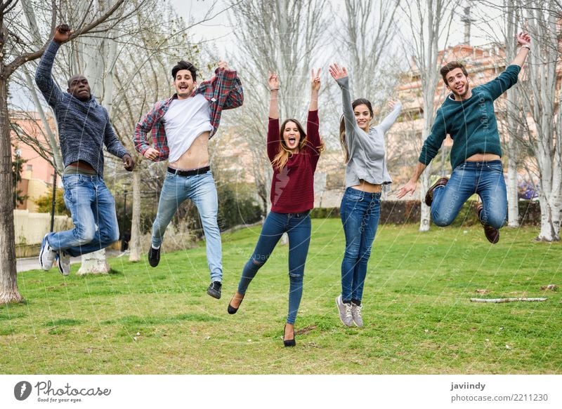 Multiracial young people jumping together outdoors Lifestyle Joy Happy Academic studies Human being Masculine Feminine Young woman Youth (Young adults)