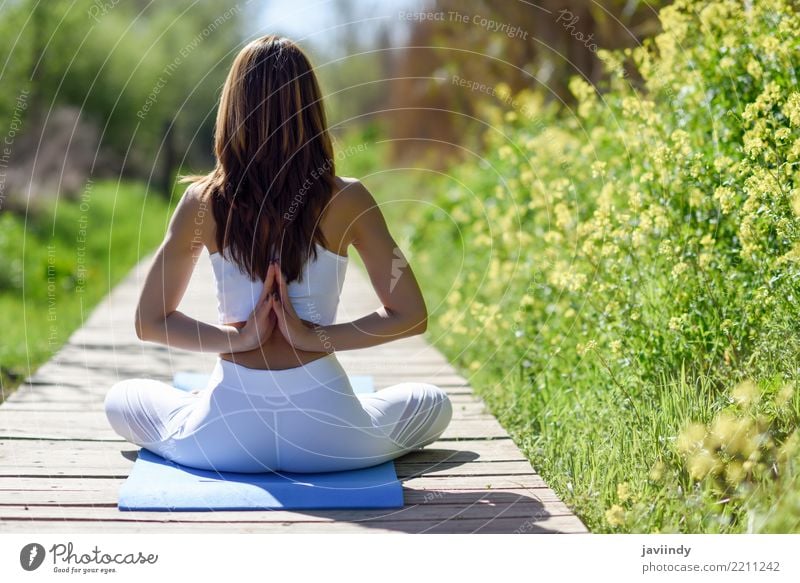 Back view of young woman doing yoga in nature Lifestyle Beautiful Body Relaxation Meditation Sports Yoga Human being Feminine Woman Adults Arm Hand 1