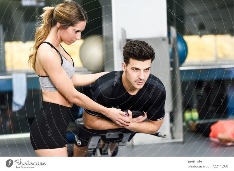 Female personal trainer helping a young man Lifestyle Body Sports Human being Masculine Feminine Woman Adults Man 2 18 - 30 years Youth (Young adults) Railroad