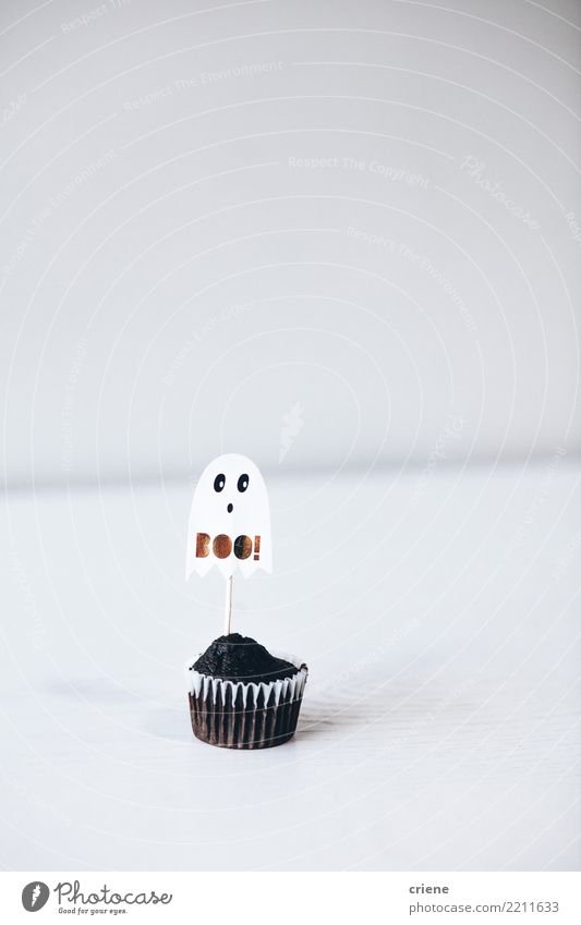 Halloween chocolate cupcake on white background Decoration Eating Hallowe'en Accessory White Cupcake food Ghosts & Spectres  kids mimimalism Minimalistic Spooky