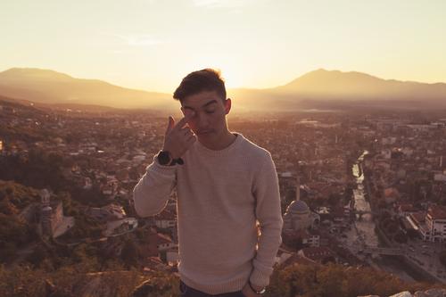 To shed a tear Human being Masculine Youth (Young adults) 1 13 - 18 years Sunrise Sunset Sunlight Warmth Hill Prizren Kosovo Europe Town Outskirts Sweater Cry