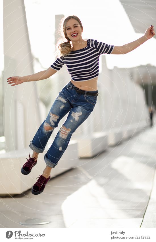 Funny blonde woman jumping in urban background. Lifestyle Joy Happy Beautiful Hair and hairstyles Freedom Success Human being Feminine Woman Adults 1