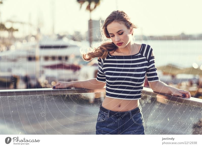 Blonde woman standing in a harbor Lifestyle Happy Beautiful Hair and hairstyles Summer Human being Woman Adults Street Fashion Shirt Jeans Braids Sit