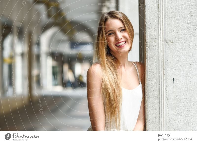 Beautiful blonde girl in urban background wearing white dress Lifestyle Happy Hair and hairstyles Face Summer Human being Feminine Woman Adults