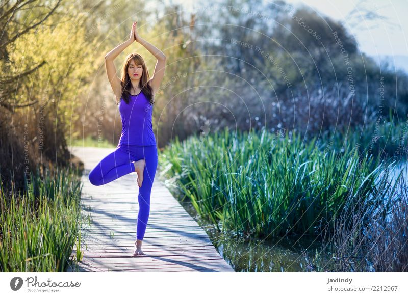 Young woman doing yoga on wooden road in nature Lifestyle Happy Beautiful Body Relaxation Meditation Summer Sports Yoga Human being Feminine Woman Adults 1