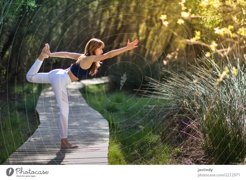 Young woman doing yoga on wooden road in nature Lifestyle Beautiful Body Relaxation Meditation Summer Sports Yoga Human being Feminine Woman Adults 1