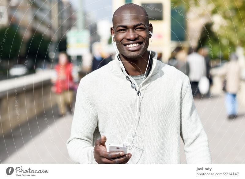 Black young man with a smartphone in his hand Lifestyle Happy Beautiful Face Telephone PDA Technology Human being Man Adults 1 18 - 30 years