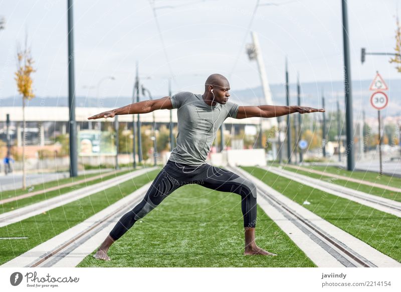 Black man practicing yoga in urban background. Lifestyle Beautiful Body Relaxation Meditation Sports Yoga Human being Man Adults 1 18 - 30 years