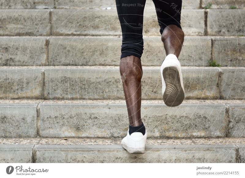 Athletic legs of black sport man with sharp muscles Lifestyle Body Sports Jogging Human being Man Adults Legs Fitness Muscular Black Power stairs running steps
