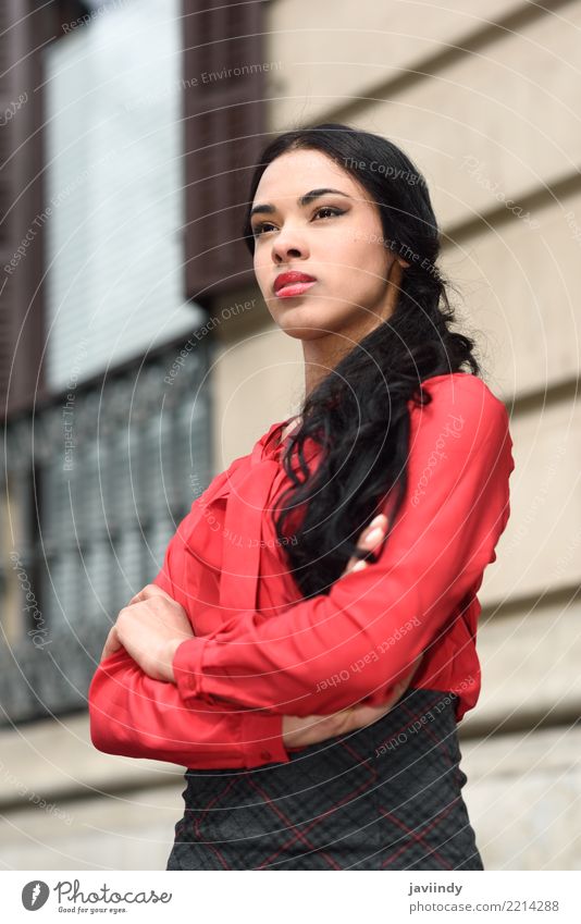 Young Hispanic bussinesswoman in urban background Business Human being Woman Adults Street Flight Attendant Shirt Skirt Brunette Red Black Businesswoman girl