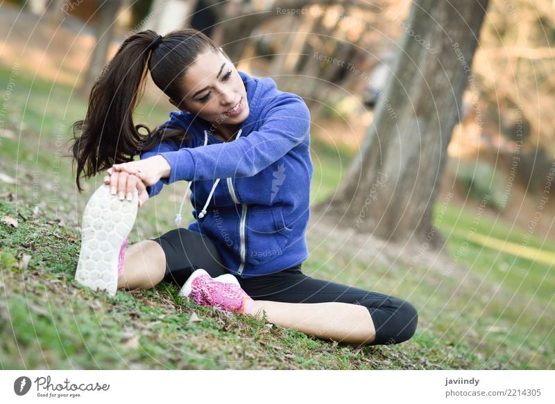 Young woman stretching after running outdoors. Lifestyle Beautiful Wellness Sports Human being Woman Adults Park Brunette Fitness Cute White young Practice