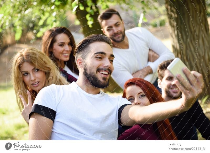 Group of friends taking selfie in urban park Lifestyle Joy Happy Beautiful Leisure and hobbies Telephone PDA Camera Woman Adults Man Friendship 6 Human being