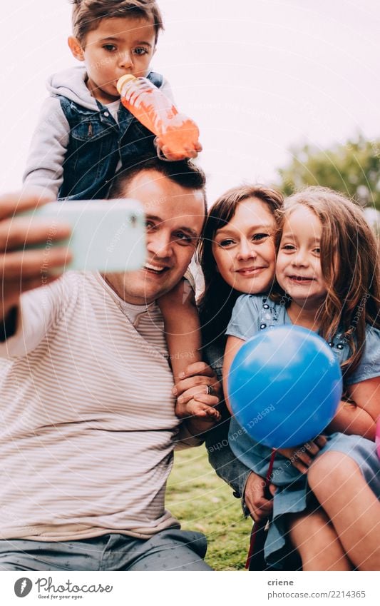 Happy caucasian family taking selfie with phone together Lifestyle Joy Leisure and hobbies Parenting Child Telephone Technology Human being Toddler Girl