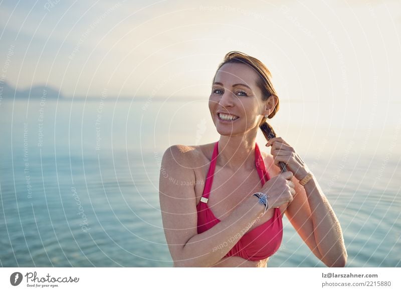 Happy smiling middle-aged woman at the seaside Beautiful Skin Face Wellness Relaxation Vacation & Travel Tourism Summer Beach Ocean Woman Adults 1 Human being