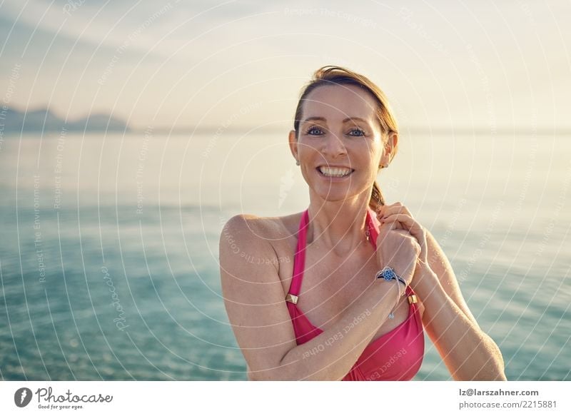 Happy smiling middle-aged woman at the seaside Beautiful Skin Face Wellness Relaxation Vacation & Travel Tourism Summer Beach Ocean Woman Adults 1 Human being
