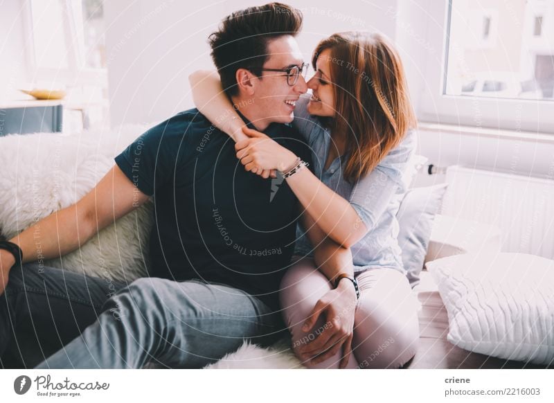 Cute young adult couple having fun at home Joy Happy Relaxation Leisure and hobbies House (Residential Structure) Living room Woman Adults Man Couple