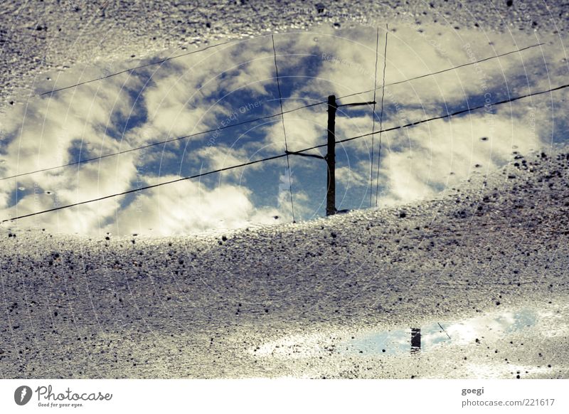 puddle of clouds Water Sky Clouds Blue Gray Black White Electricity pylon High voltage power line Telegraph pole Telephone line Puddle Colour photo