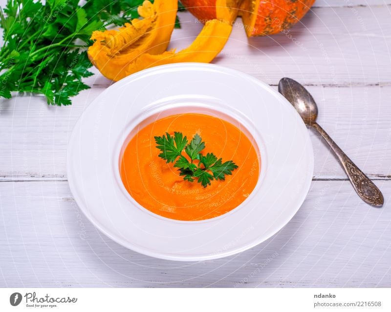 Pumpkin soup puree Vegetable Soup Stew Eating Lunch Dinner Organic produce Vegetarian diet Diet Plate Spoon Table Autumn Wood Fresh Hot Above Yellow White
