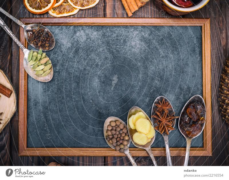empty black chalkboard and spices Food Herbs and spices Beverage Alcoholic drinks Mulled wine Spoon Wood Above Retro Brown Black sweet holiday anise ginger