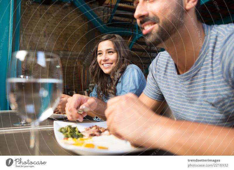 Couple having lunch at rustic gourmet restaurant Eating Lunch Dinner Drinking Style Design Happy Beautiful Vacation & Travel Table Restaurant Woman Adults Man