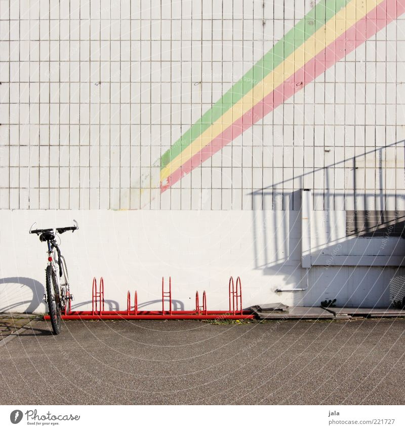 Drive with me to pan Africa. Bicycle Manmade structures Building Facade Tile Places Bicycle rack Stripe Colour photo Deserted Copy Space top Day Light Shadow
